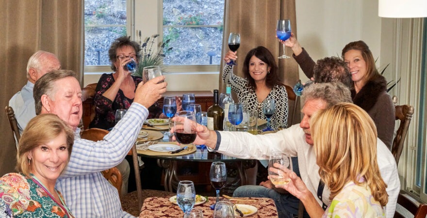 Men and women gathered for a dinner party in Southern California